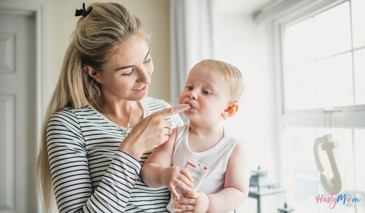 mother putting baby gel on baby