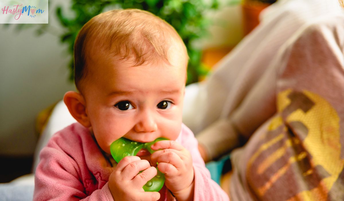 baby teething on toy